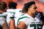 New York Jets guard Alijah Vera-Tucker (75) in the first half of an NFL football game Sunday, Oct. 8, 2023, in Denver.