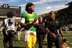 FILE — Oregon quarterback Dante Moore (5) walks off the field after the second half of an NCAA college football game, Saturday, Sept. 5, 2026, in Eugene, Ore.