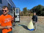 Iseman and Song prepare a balloon with sulfur dioxide and helium.