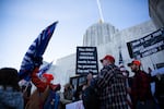 People hold signs at a Timber Unity rally in front of the Oregon Capitol in Salem, Ore., Thursday, Feb. 6, 2020.