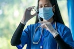 Doctor use a needle syringe to take a shot from vaccine vial,Successful,Safe and effective vaccines,The power of science against COVID-19 Virus.