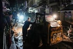 Rescue workers work at the site of an Israeli airstrike in Beirut, Lebanon, Monday, Nov. 18, 2024.