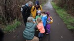 Kendra Callahan teaches a group of children who were walking on Bald Hill Multi-Use Path about beavers.