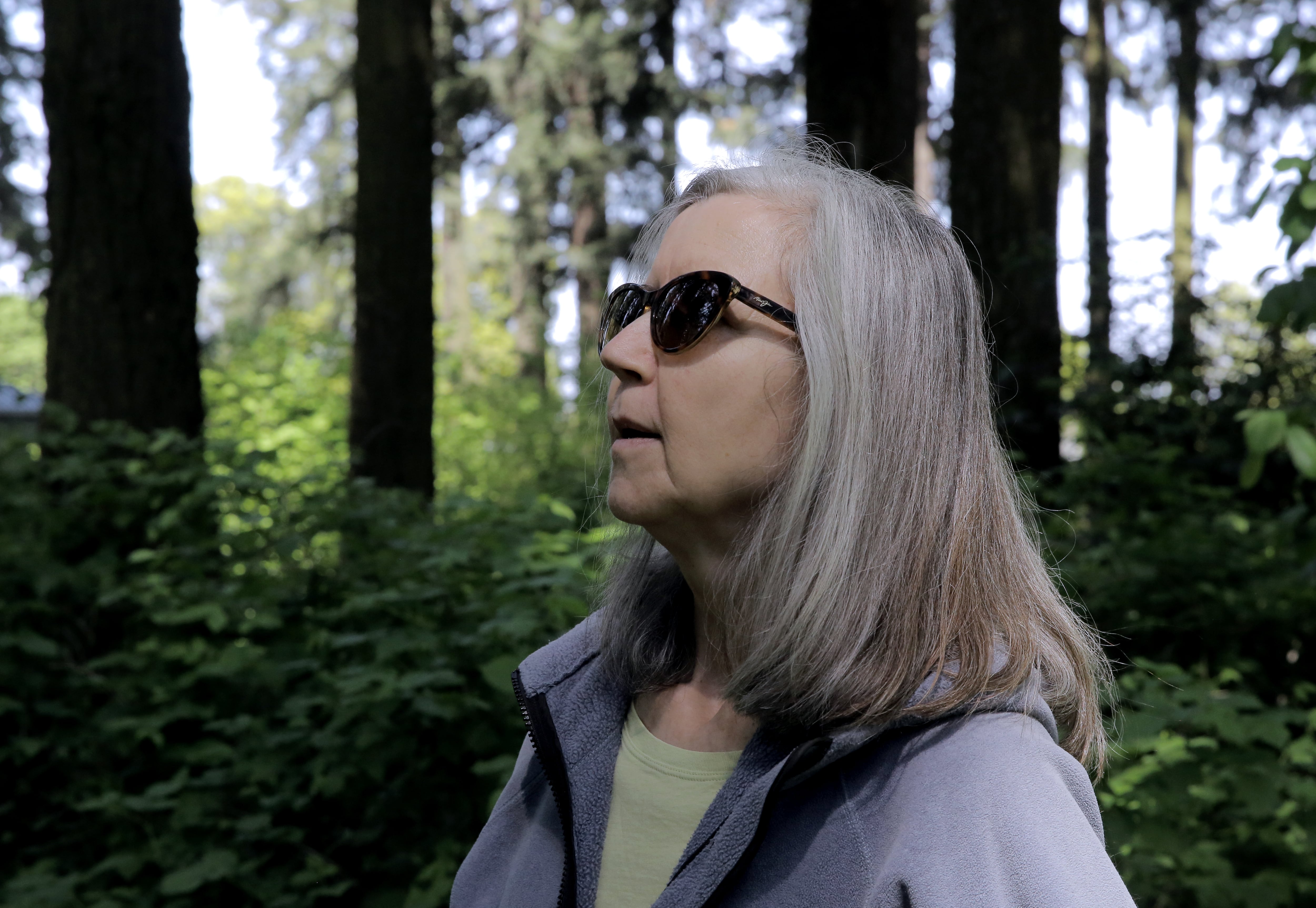 Landscape designer Eileen Stark, would like to see the muscle tree turned into a snag, so it can provide a home for birds, amphibians and plants. Alberta Park, North Portland, April 24, 2025