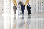 President Trump tours the Sheikh Zayed Grand Mosque, including the mausoleum of the late founder Sheikh Zayed bin Sultan al Nahyan, with UAE President Sheikh Mohamed bin Zayed Al Nahyan and Dr. Yousef Al-Obaidi, Director-General of the Sheikh Zayed Grand Mosque Center (SZGMC) and Ameena Alhammadi, Acting Director of Culture and Knowledge Department of Sheikh Zayed Grand Mosque Centre on May 15 in Abu Dhabi, United Arab Emirates. Trump is on the third day of his visit to the Gulf to underscore the strategic partnership between the United States and regional allies including the UAE, focusing on security and economic collaboration.