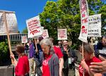 About 100 members from the Portland State University chapter of American Association of University Professors rallied in downtown Portland, Ore., Wednesday, June 5, 2024, ahead of contract negotiations.