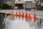 A flooded roadway on N Basin Avenue near Emerson Street in Portland, Ore., Dec. 9, 2025.