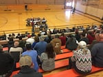 About 300 people filled the bleachers at the Sherman County High School to discuss whether a large organic farm is letting its weeds spread onto neighboring property — and whether the government should do something about it.