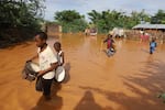 Children fleeing floodwaters that wreaked havoc at Mororo, border of Tana River and Garissa counties, northeastern Kenya, April 28.