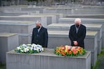 German President Frank-Walter Steinmeier, right, and the Speaker of Israel's Knesset parliament Mickey Levy arrange wreaths on one of the concrete steles of Berlin's Holocaust memorial, on Thursday, Jan. 27, 2022, as part of the ceremonies on the International Holocaust Remembrance Day.