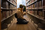 Natalie Swenson, 36, browses the second floor stacks at the Downtown Bend Library in Bend, Ore., on Jan., 21, 2026. The downtown public library is closing on Apr. 11, 2026 as part of a planned renovation.