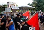 In this Saturday, Aug. 11, 2018 file photo, a group of anti-fascist and Black Lives Matter demonstrators march in front of the Rotunda on the campus of the University of Virginia in anticipation of the anniversary of the previous year's Unite the Right rally in Charlottesville, Va.