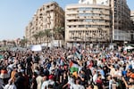 Demonstrators shout slogans during a protest in support of the Palestinian people at Tahrir Square in Cairo on Oct. 20.