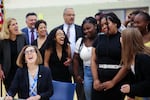 Oregon Gov. Kate Brown laughs with Jefferson High School students as she ceremonially signs the Student Success Act in Portland, Ore., Wednesday, Aug. 28, 2019.