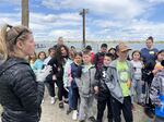 Pacific Northwest National Laboratory biologist Jill Janak explains the fish tagging process to students.