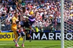 United States' Alex Freeman, center, scores his side's second goal past Australia goalkeeper Patrick Beach during the World Cup Group D soccer match between the United States and Australia in Seattle, Friday, June 19, 2026.
