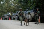 Soldiers patrol a road in Tibu in Colombia's northeastern Catatumbo region, Monday, Jan. 20, 2025, where dozens have been killed amid clashes between the National Liberation Army (ELN) and former members of the Revolutionary Armed Forces of Colombia (FARC).