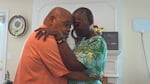 Caregiver Malcoma Brown-Ekeogu and her husband, Kenneth, dance on their wedding anniversary. Both are featured in Caregiving.