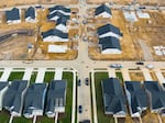 Completed and under construction new homes are seen a site in Trappe, Md., in 2022. Lower interest rates and an expected bump in demand from buyers is likely to spur more homebuilding.