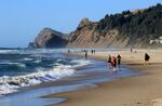 This May 2010 photo shows people on a stretch of beach in Lincoln City, Ore.