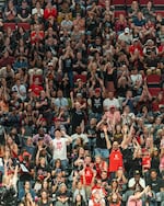 Fans of the Portland Fire cheer during the WNBA game at the Moda Center in Portland, Ore., on July 9, 2026.