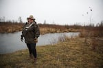 Christina Eastman stands for a portrait by the North Santiam River on the back edge of her family's farm in Scio, Ore., Friday, Dec. 9, 2022. An industrial-scale chicken farm is slated to move in next door, and Eastman has worked to oppose the project.