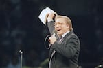 The Rev. Jimmy Swaggart gestures with the Bible at the Los Angeles Sports Arena during a service in Los Angeles in 1987.