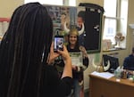 Cleveland High School senior Alma Avena smiles as Portland State University admissions counselor Marshawna Williams takes her photo. Avena was just accepted to PSU, at an "Instant Viking" event.