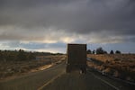 A truck loaded with hay bales leaves Harney County, Oregon on Dec. 13, 2019. 