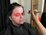 Shell Galloway, a haunted house actor, transforms into a goth vampire for the Underhill Haunted House on Oct. 25, 2024.