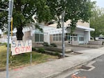 A banner that reads "Save OJM" outside the ICE facility on S Macadam Ave. in Portland, Ore. A woman, known in court documents as "O-J-M" was arrested outside of Portland Immigration Court earlier this week.