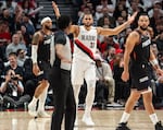Portland Trail Blazers forward Toumani Camara reacts to a referee’s call as Phoenix Suns guard and forward Dillon Brooks, right, looks on.