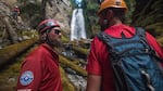 The safety and rigging team, Jared Smith, left, and Mike Williams, right, stand below the waterfall nicknamed "NE Shangri-La."