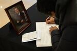 The public write notes in condolence books in the Capitol Visitor Center, near the flag-draped casket of former President Jimmy Carter lying in state in the U.S. Capitol in Washington, D.C., on Jan. 8.