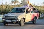 A man flashes the V-sign while driving a vehicle loaded with belongings through the al-Qassimyah area en route to southern Lebanon early on Wednesday, after the U.S. and Iran agreed to a two-week ceasefire. Israel continued its strikes in Lebanon saying it was not part of the truce.