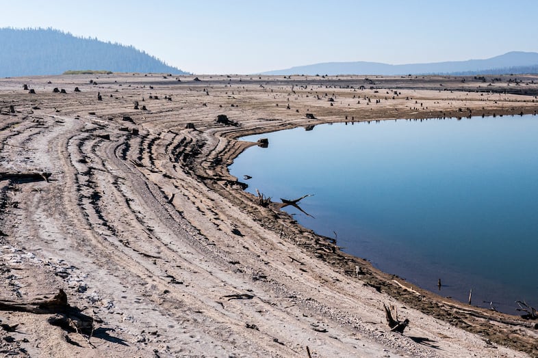 In this file photo from September 2021, the lake bed of the Wickiup Reservoir is exposed by drought conditions that left the reservoir at 1% capacity, near La Pine, Ore.