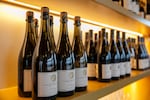 FILE — Bottles of Cuvée Brut line the shelves at CHO Wines, Hillsboro, Ore., Dec. 14, 2024. About 40% of CHO's production is sparkling wine, and their 2018 Blanc de Noirs Sparkling Pinot Noir was one of five Oregon sparkling wines to make Wine Enthusiast's 2024 top 100 wines list. 