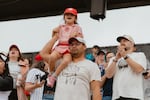 A young fan dons a Rockford Peaches uniform - a nod to the All-American Girls Professional League and inspiration for the Hollywood blockbuster "A League of Their Own" - at Opening Day of the Women's Pro Baseball League. Springfield, IL, August 1, 2026.