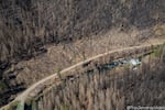 A band of burned trees removed along Highway 224 upslope from a protected Wild and Scenic stretch of the Clackamas River.