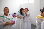 Ruth Infante (second from left), a single mother of three, and her classmates donned traditional flowing dresses for their <em>Cumbia</em> dance performance at a center in Bogotá, Colombia, that provides happy respite for family caregivers.