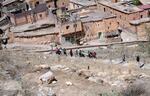 People prepare to bury a man who was killed by the earthquake, in Moulay Brahim village, near Marrakech, Morocco.