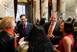 Washington Attorney General Bob Ferguson, left, and HB1240 sponsor Rep. Strom Peterson, D-Edmonds, right, talk with other lawmakers ahead of the signing of firearms regulation bills by Washington Gov. Jay Inslee on April 25, 2023, in Olympia, Wash.