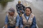 Oswaldo Beltrán (left) said armed intruders burst into his home while he was gone, tied up his wife and threatened to chops his sons fingers off unless he told them of his father's whereabouts. But he continues to work with Velásquez in the fishers association.