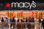 Black Friday shoppers pass by at the Walden Galleria's Macy's in Buffalo, NY., on Friday.