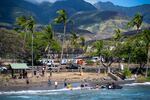 The local surfing community are shuttling donated items on jet boats to get them from from large boats to the shore on the north side of Lahaina.