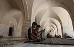 Palestinian boys read the Koran at the Great Omari Mosque in Gaza City on Aug. 1, 2011.