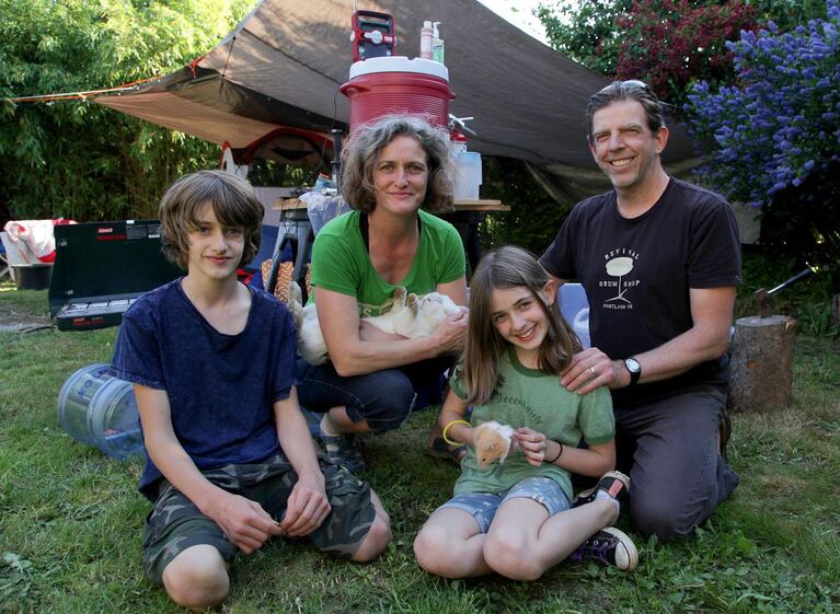 The Stephens with what remains of their emergency supplies after a weekend of living off their disaster kit. They pitched tents and ate from their stock of nonperishable foods.