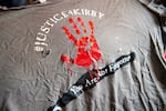 A shirt, printed with words "#JUSTICE4KIRBY" and "You Are  Not Forgotten," was made after Kirby Paradise was shot and killed.