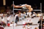 Dick Fosbury clears the bar in the high jump competition at the 1968 Mexico City Olympics.