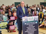 Washington Gov. Jay Inslee announced his 2024 climate agenda in Seattle Monday, Dec. 11, 2023, with a crowd of supporters present to show their support for the state's Climate Commitment Act. 